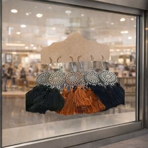 Three pair of round flower earrings.